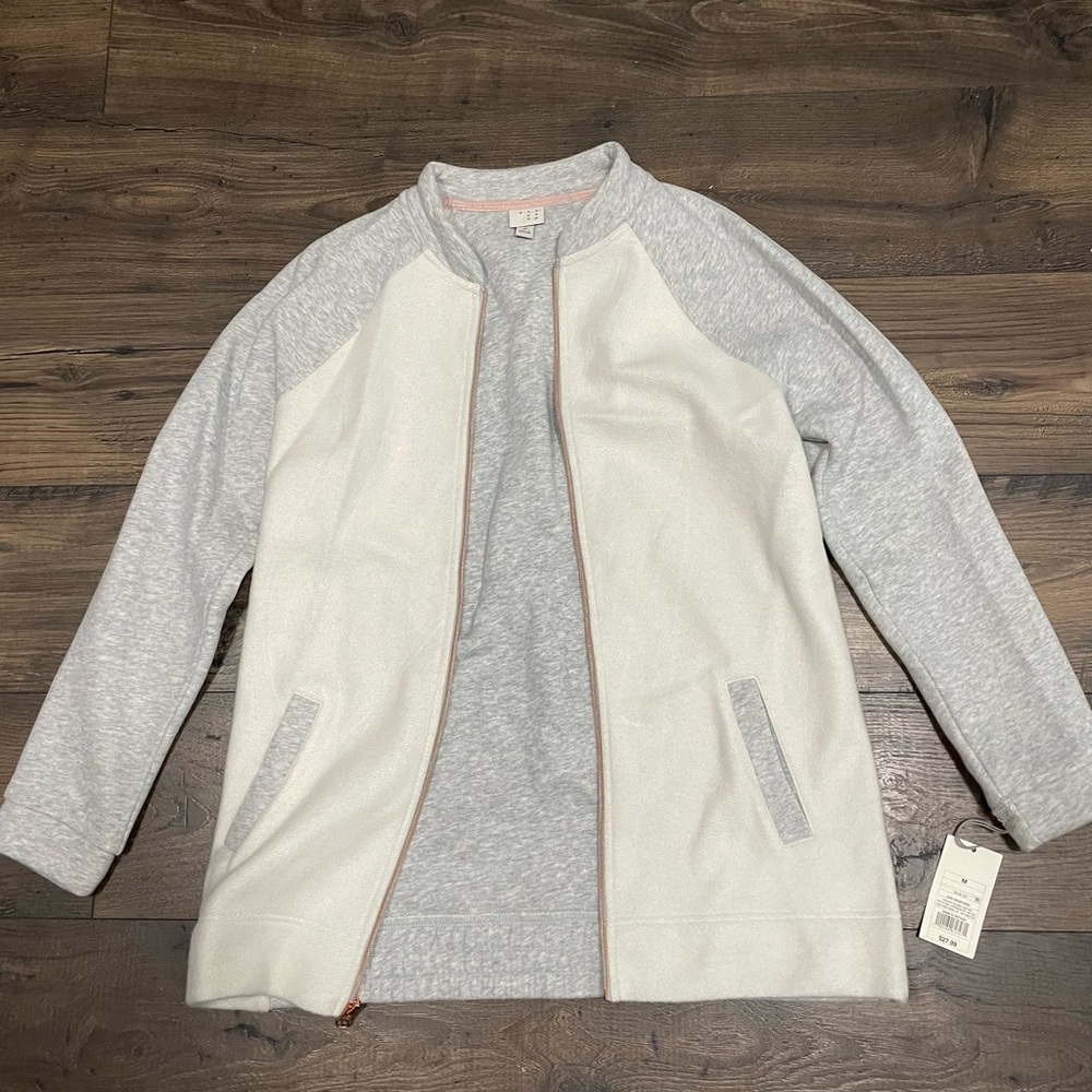 A New Day, light cotton jacket. Not waterproof. Medium.